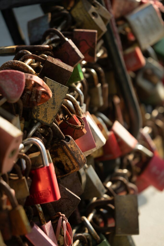 Close-up of colorful padlocks symbolizing love on Hohenzollern Bridge in Cologne, Germany.